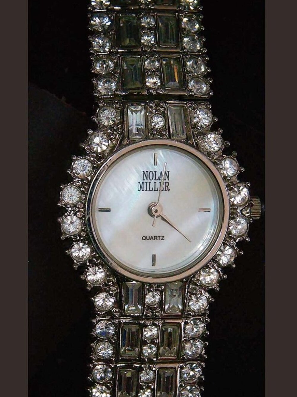 Nolan Miller Glamour Rhinestone Silvertone Ladies Watch MOP Face